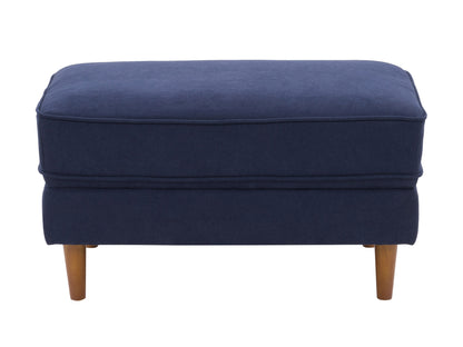 Navy blue mid-century modern ottoman with wooden legs and tufted cushion.