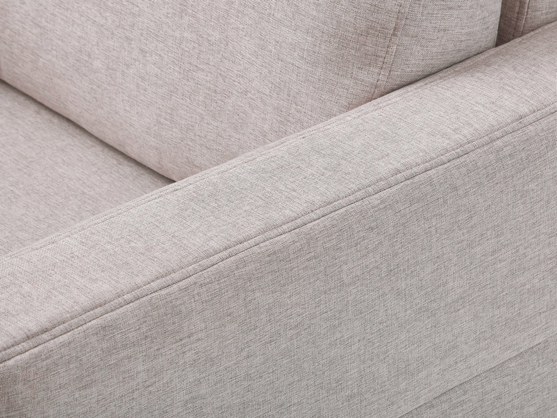 Modern gray fabric sofa with tufted cushions, wooden legs, and sleek armrests, perfect for contemporary living rooms.