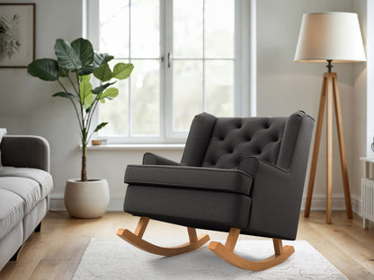 Dark grey fabric rocking chair with wooden legs and armrests, featuring a timeless design and comfortable cushioning.