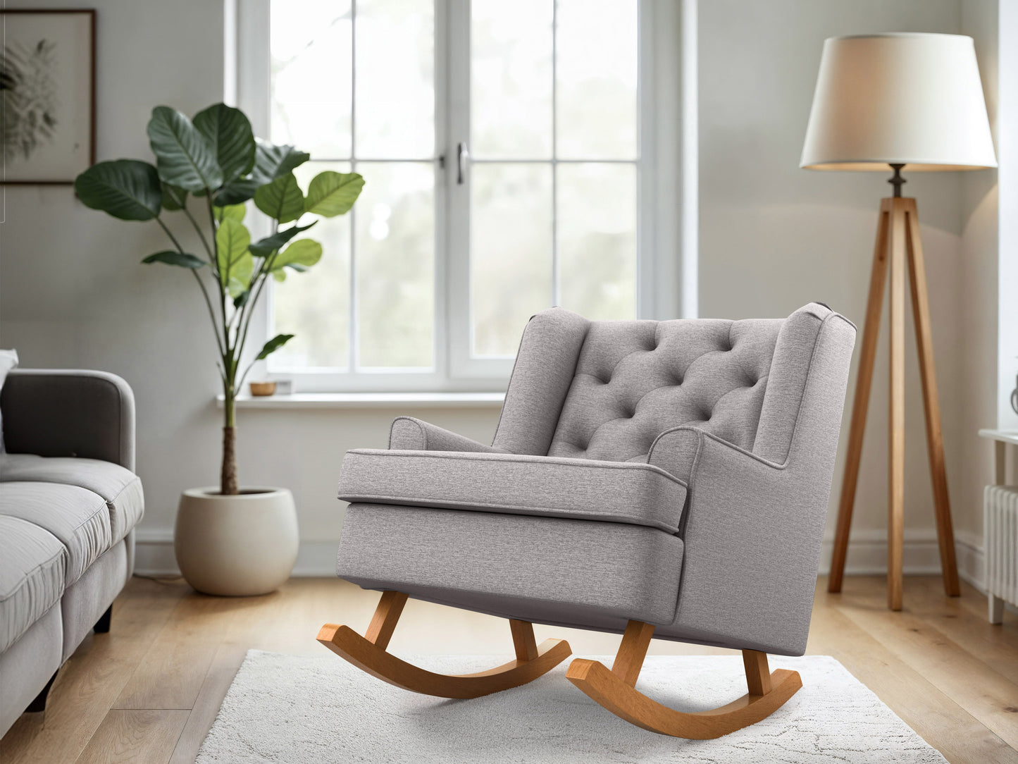 Light grey rocking chair with wooden rockers, tufted backrest, and modern minimalist design.