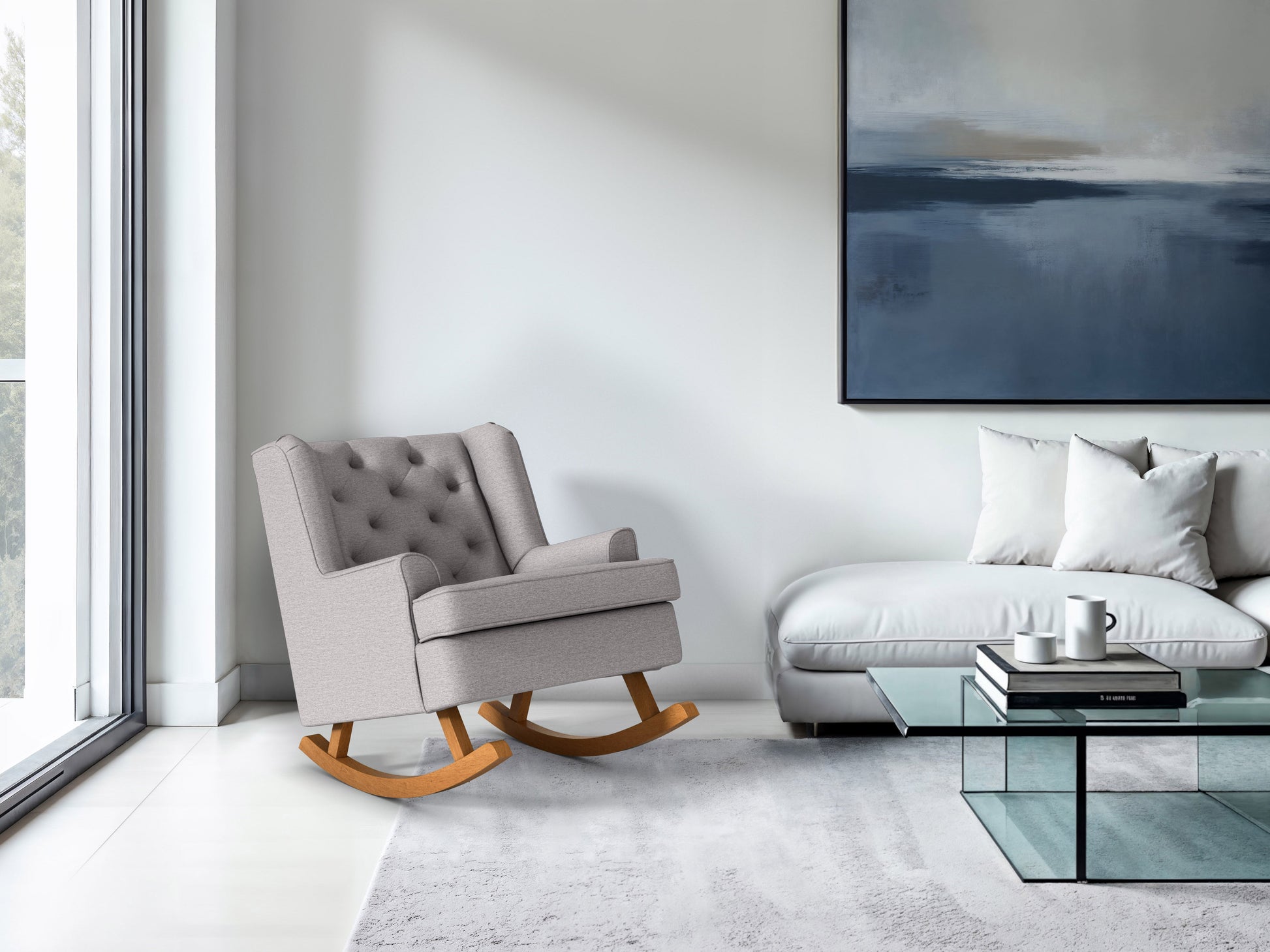 Light grey fabric rocking chair with wooden legs, ergonomic design, and tufted backrest.