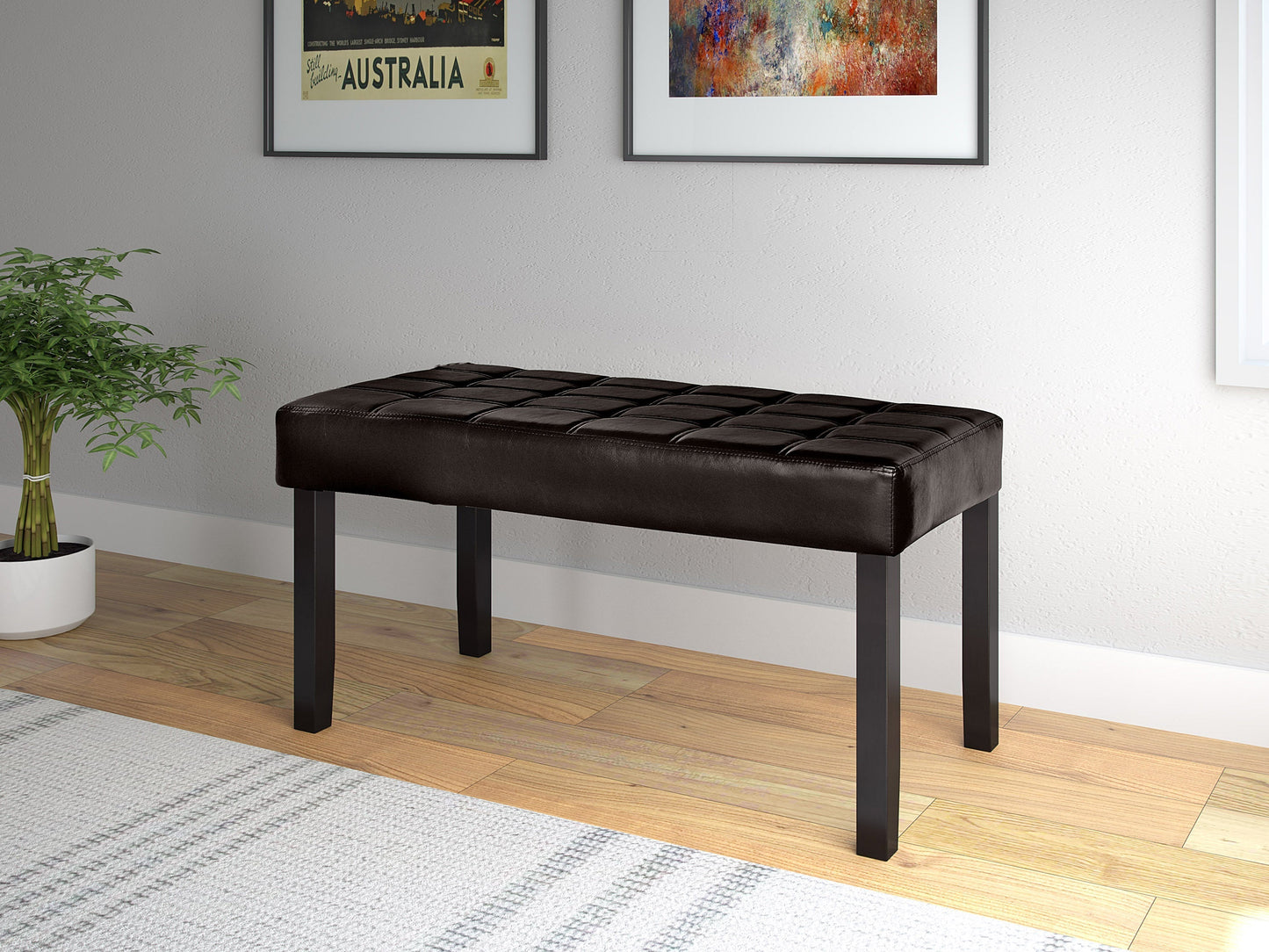 Brown leather bench with wooden legs, tufted seat, and modern design, perfect for living room or hallway.