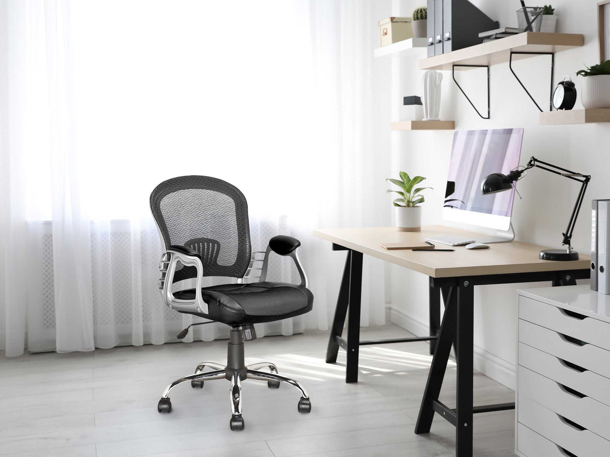 Black swivel office chair with ergonomic design, adjustable height, and cushioned seat for home or office use.