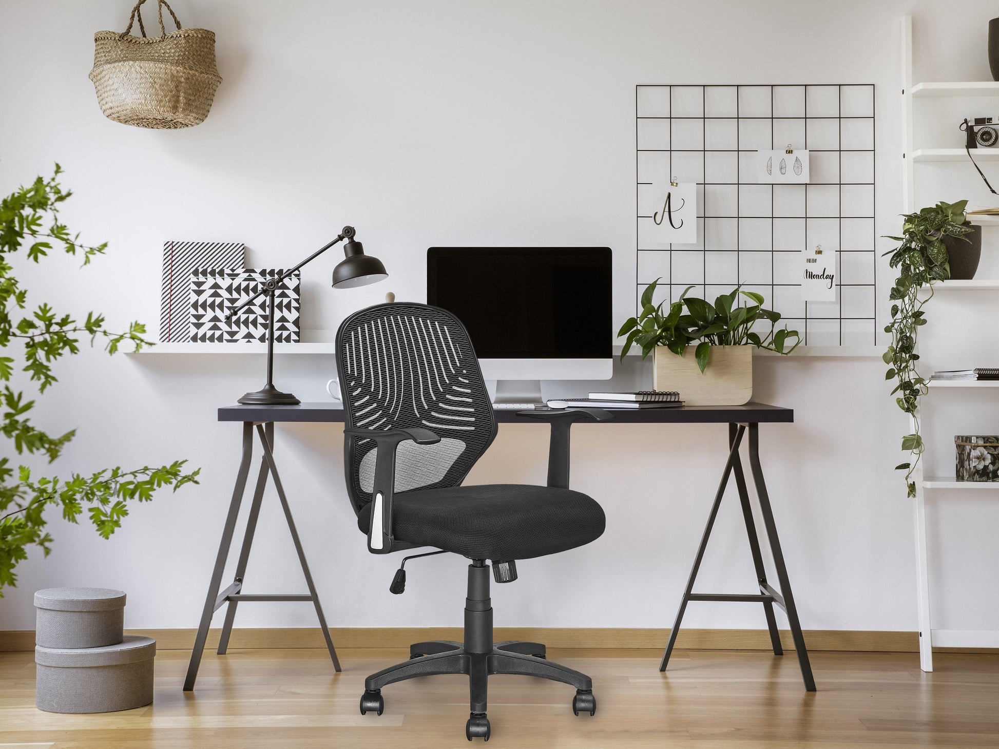 Black mesh office chair with ergonomic design, adjustable height, and lumbar support for comfortable office seating.