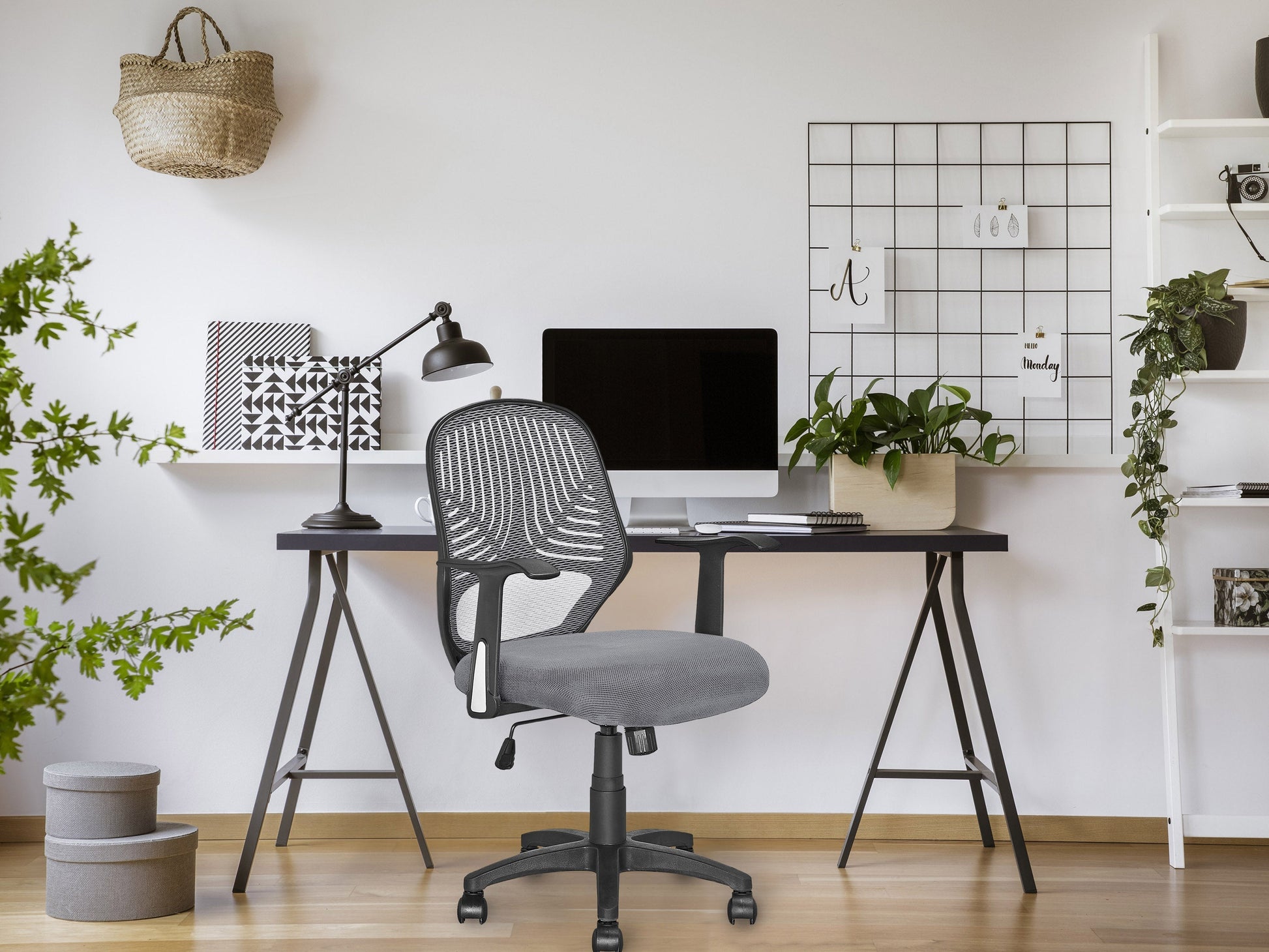 Ergonomic grey mesh office chair with adjustable armrests, lumbar support, and swivel base for modern workspaces.