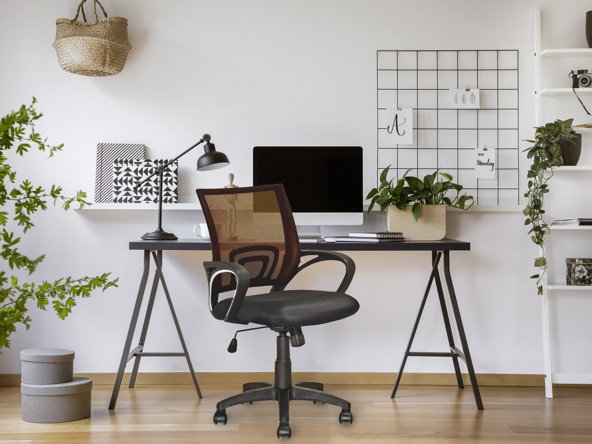 Dark brown mesh back office chair with ergonomic design, adjustable height, and swivel base for modern home office setups.