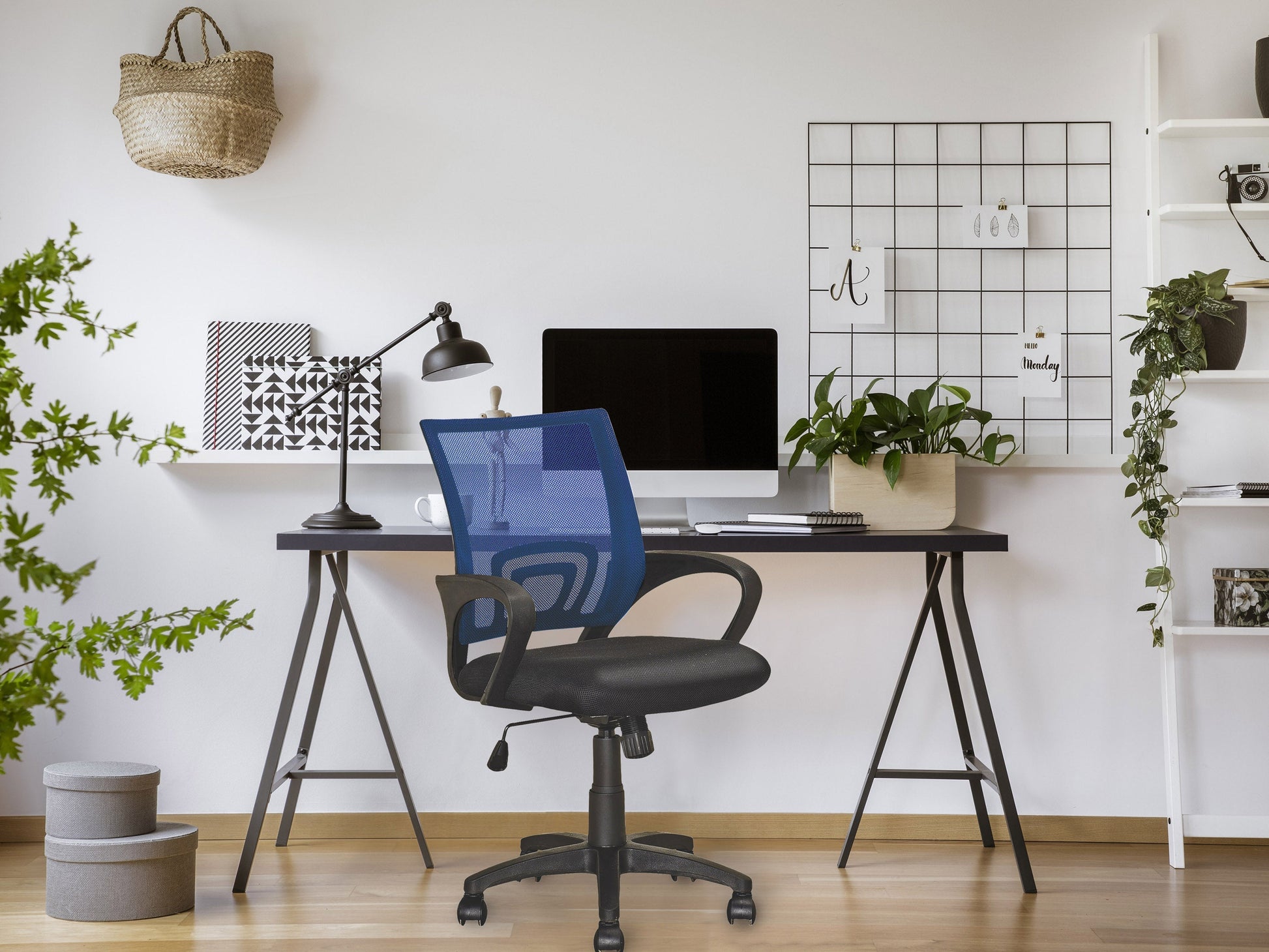 Navy blue mesh back office chair with ergonomic design, adjustable height, and black armrests.