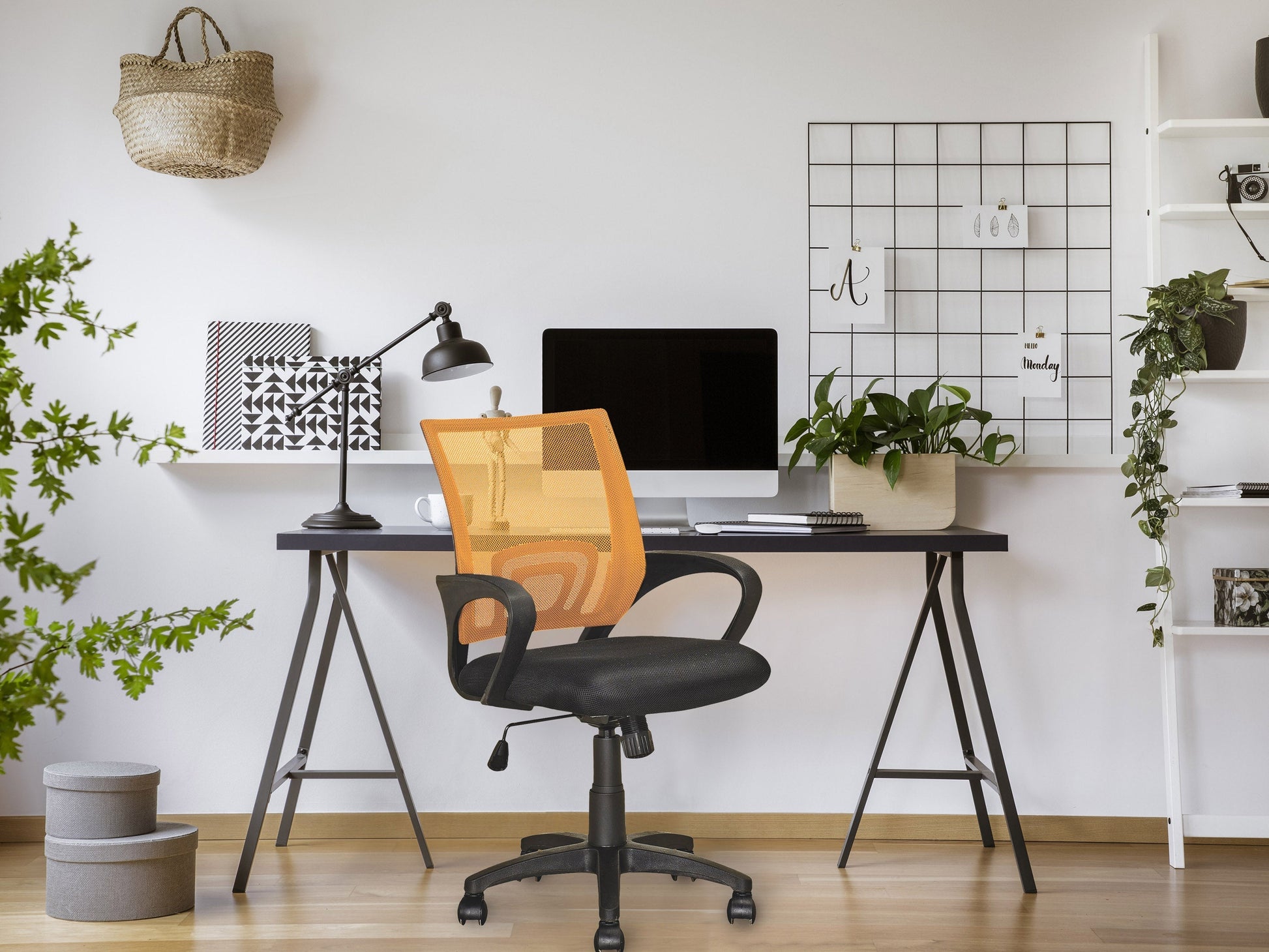 Orange mesh back office chair with ergonomic design, adjustable features, and black base.