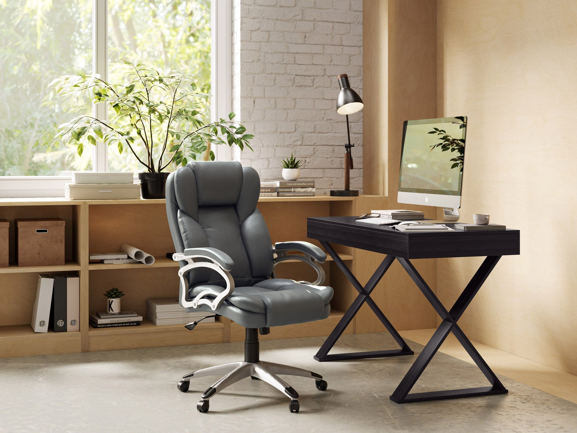 Executive grey office chair with ergonomic design, adjustable height, and padded armrests on a five-star base