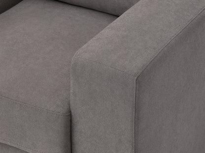 Dark grey arm chair with tufted cushions, wooden legs, and modern design.