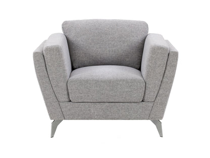 Light grey upholstered arm chair with wooden legs, tufted back, and contemporary design.