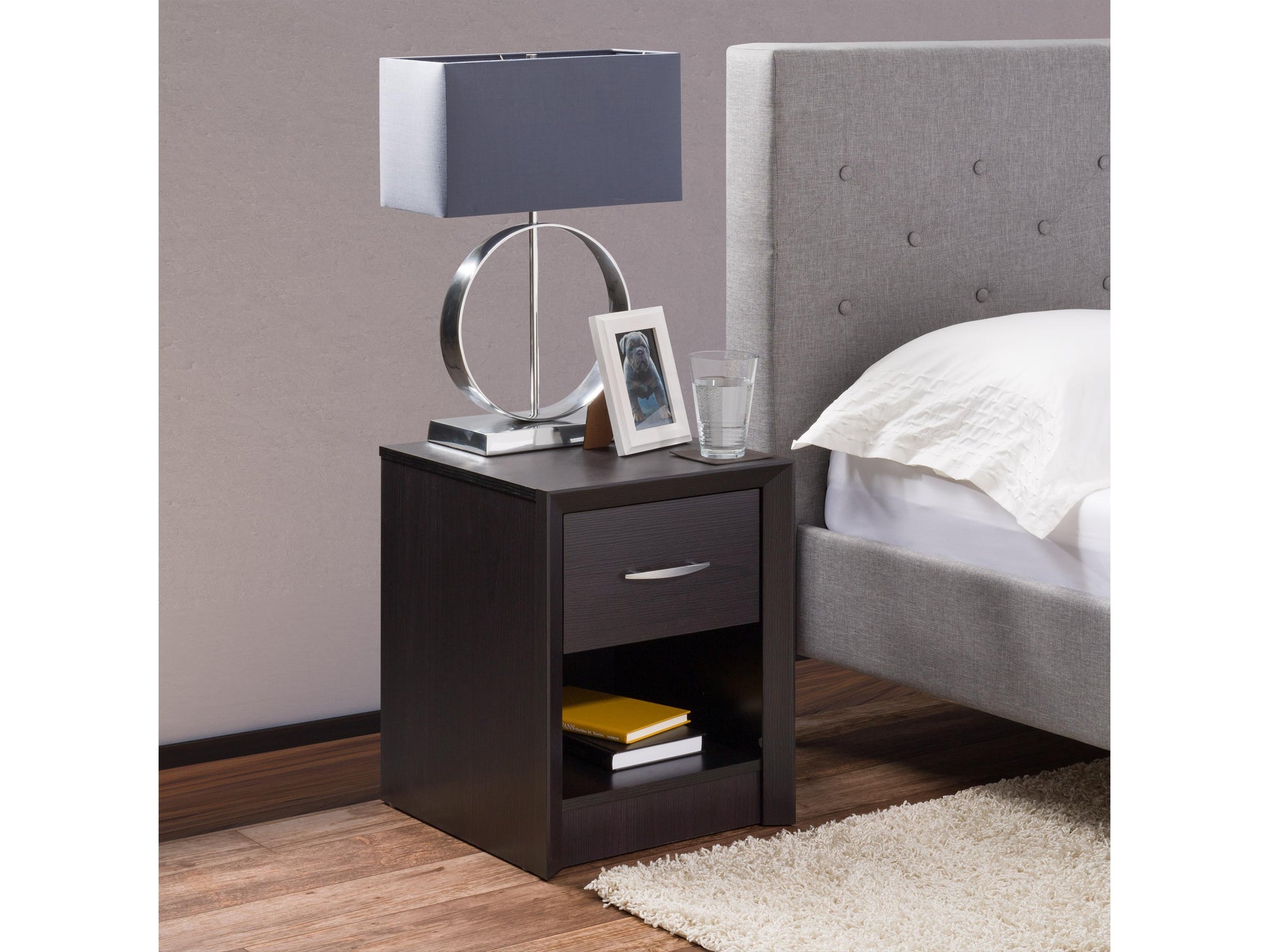 Mid-century modern black nightstand with two drawers, sleek design, and wooden legs.