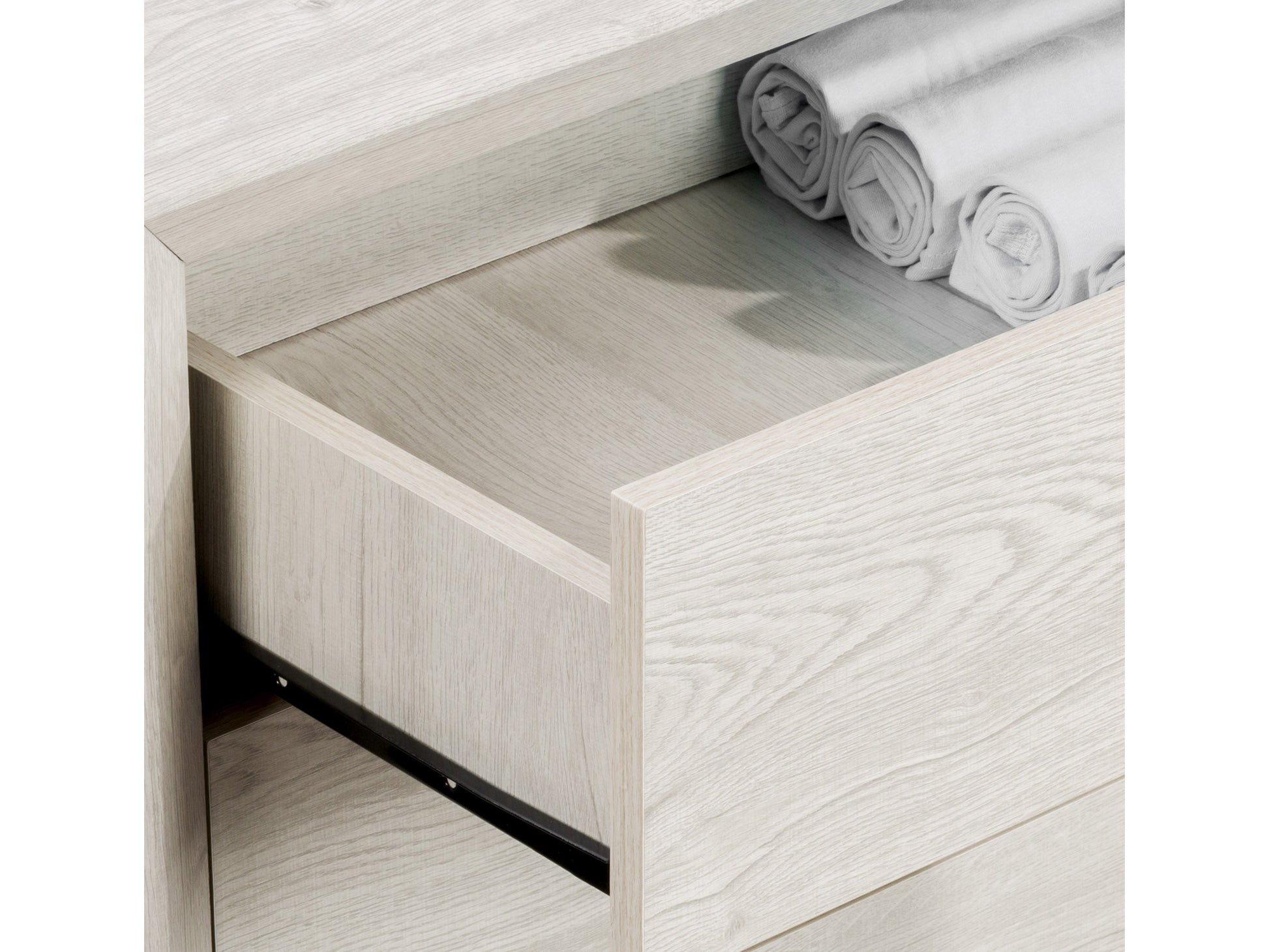 White washed oak tall bedroom dresser with five drawers and sleek metal handles.