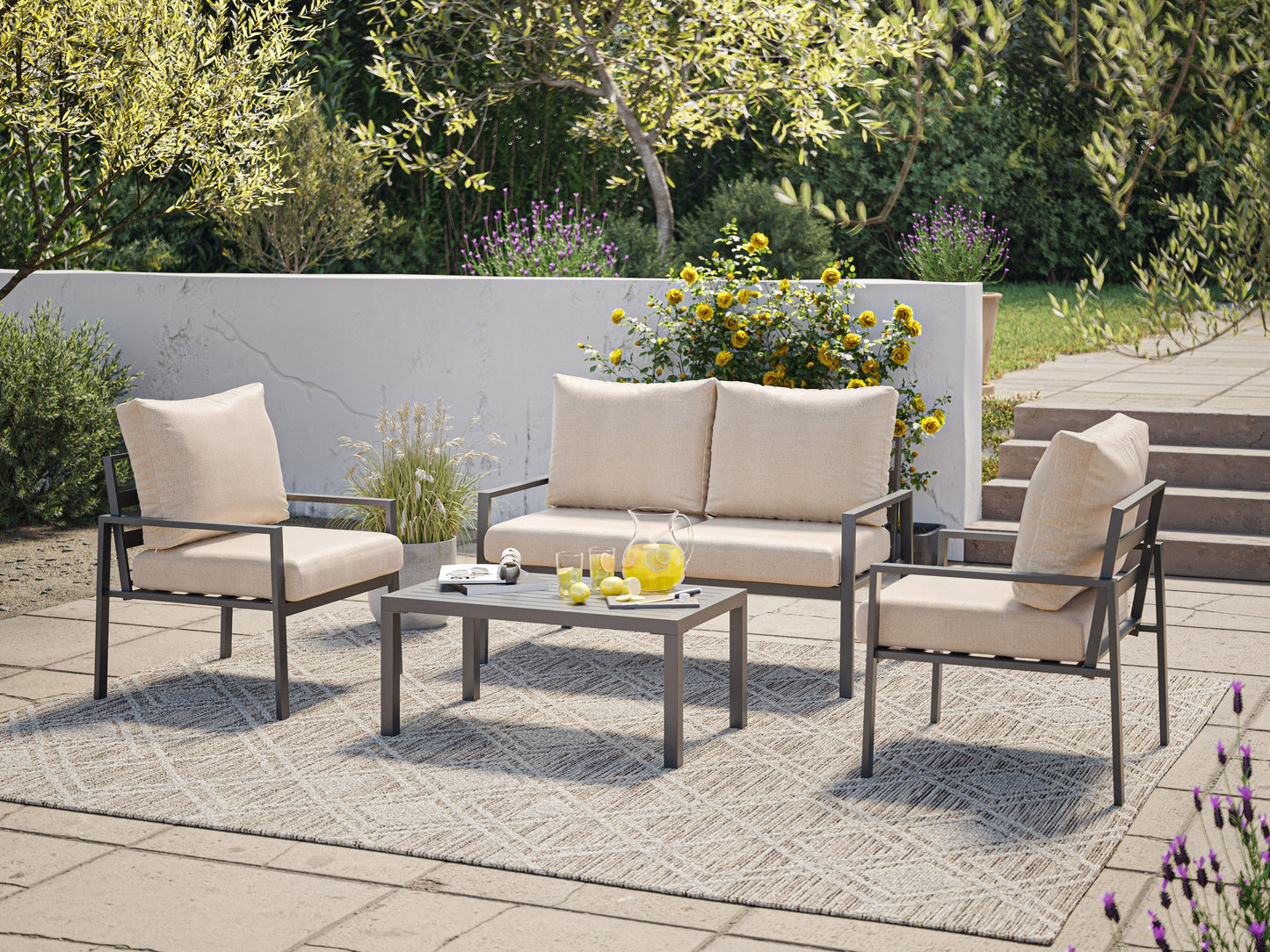 Deluxe 4-piece beige patio set with cushioned seats, glass-top coffee table, and wicker frames.