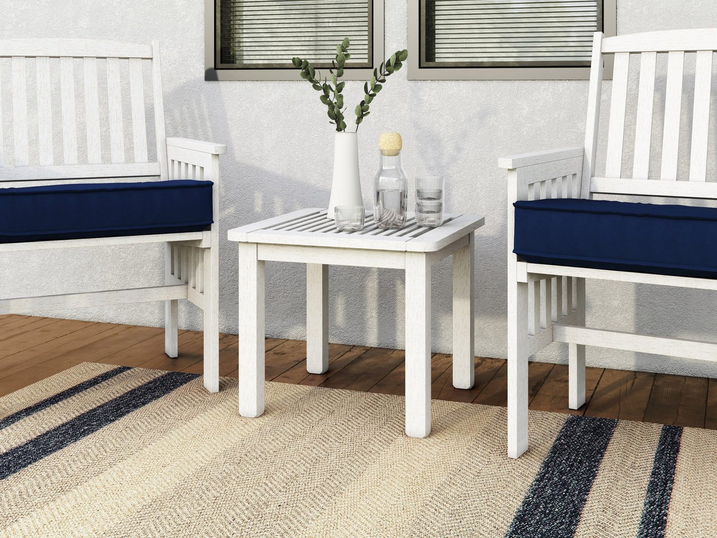 Washed white hardwood outdoor side table with slatted top and sturdy legs, perfect for patio or garden use.