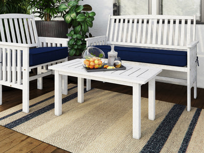 Washed white hardwood outdoor coffee table with slatted top, perfect for patio or garden settings.