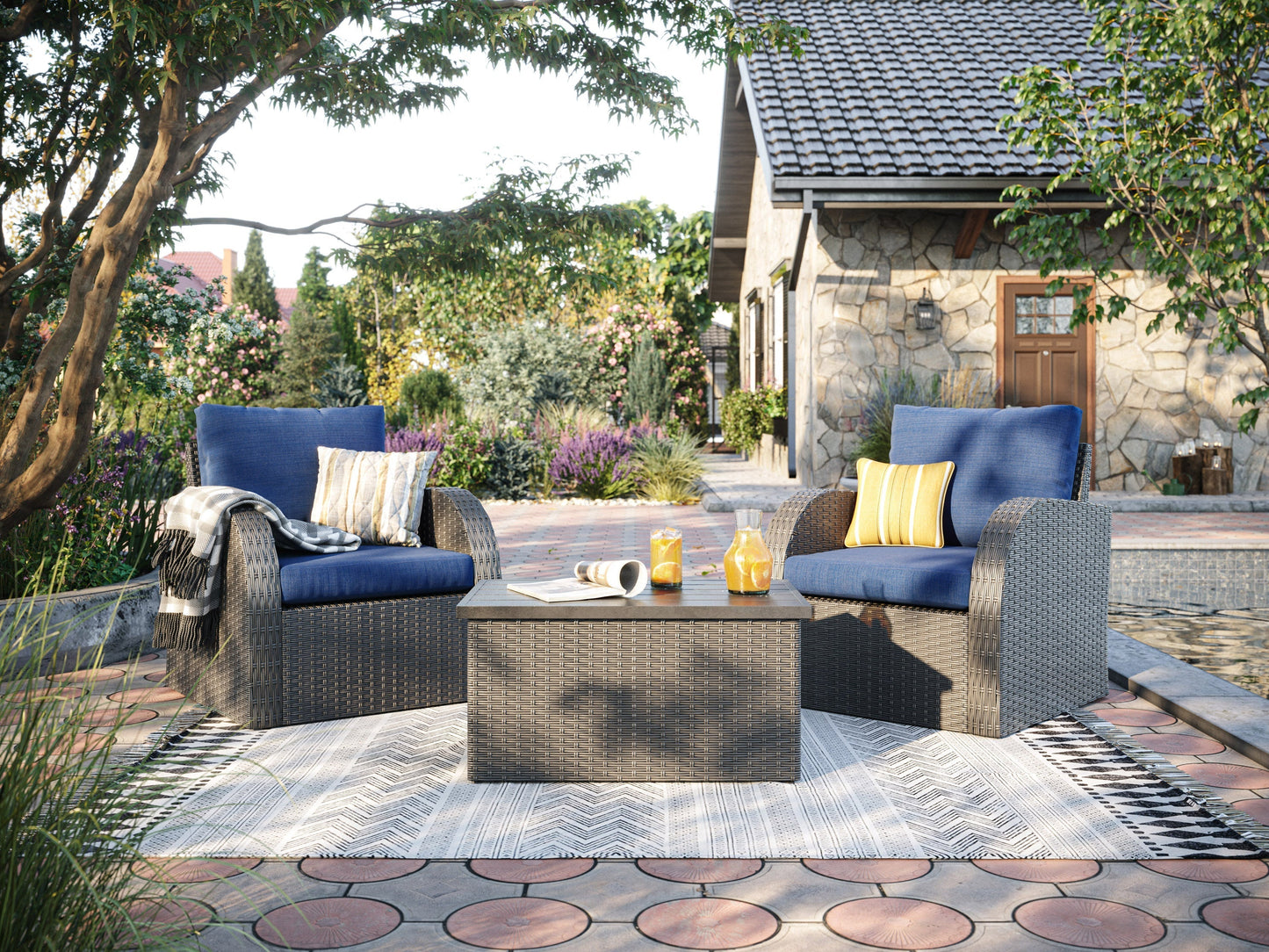 Outdoor wicker patio set with blue cushions, round table, and durable rattan frame.