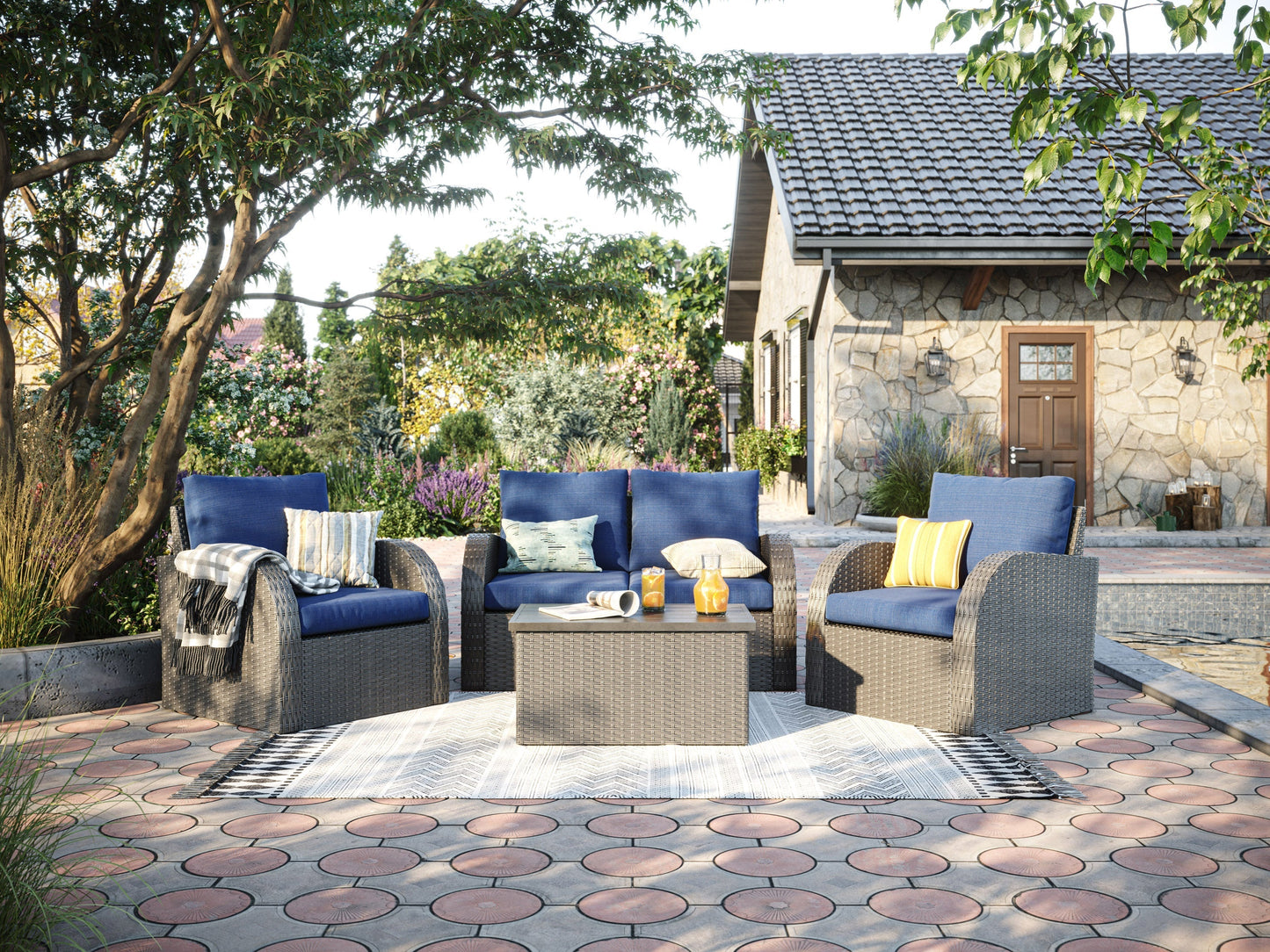 Blue outdoor patio loveseat set with cushions, wicker frame, and coffee table, ideal for garden and backyard lounging.