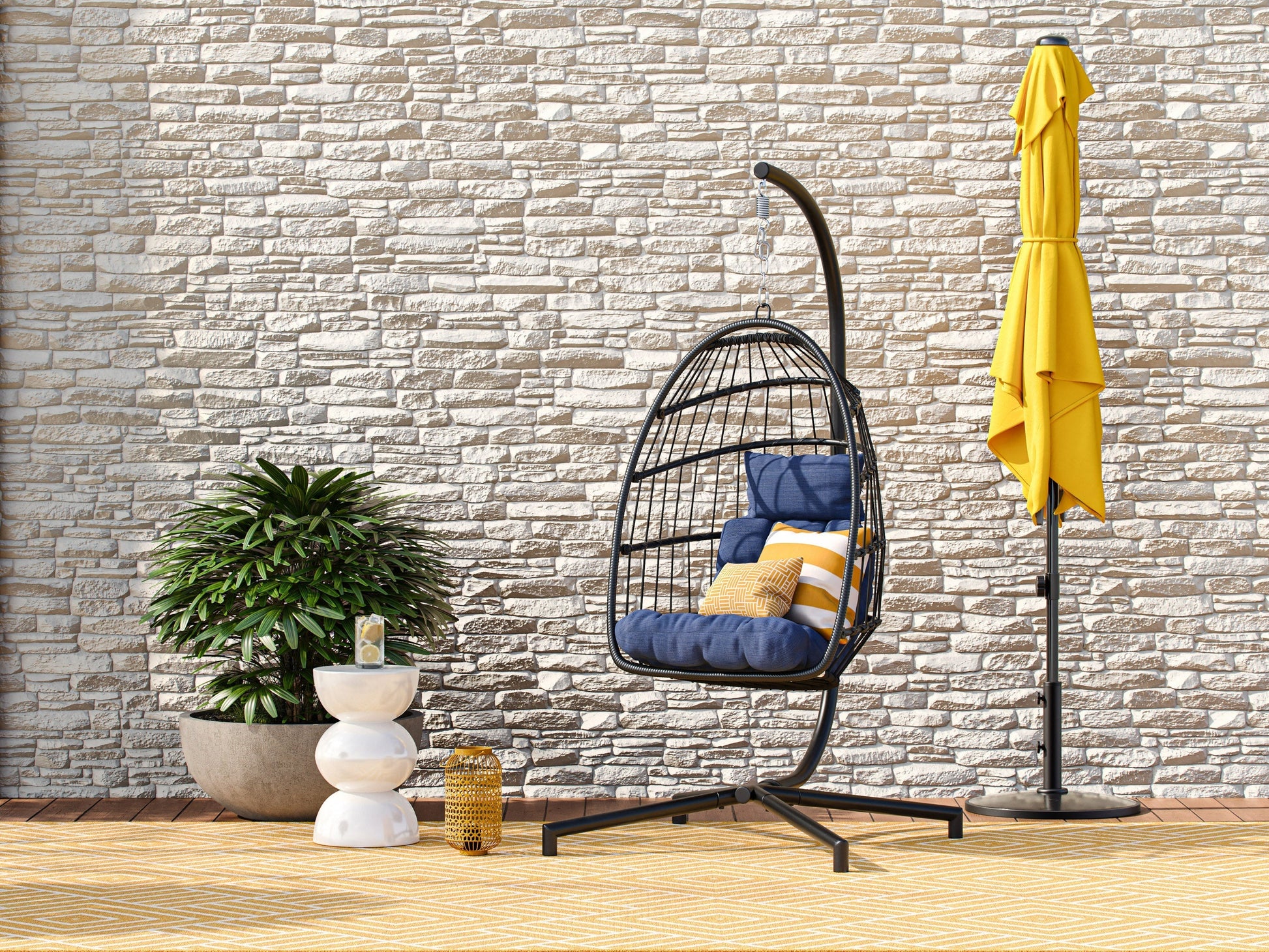 Blue hanging egg chair with cushion, rattan weave, and sturdy metal stand for patio or garden relaxation.