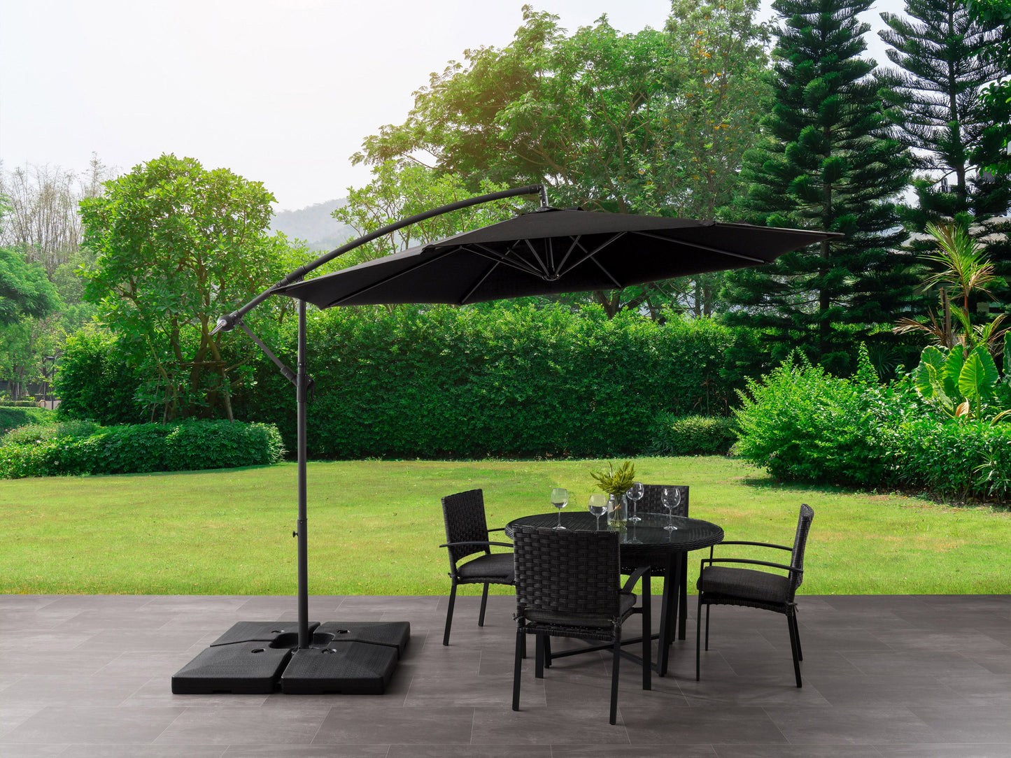 Black 9.5ft tilting offset patio umbrella with sturdy base, UV-resistant fabric, and adjustable canopy.