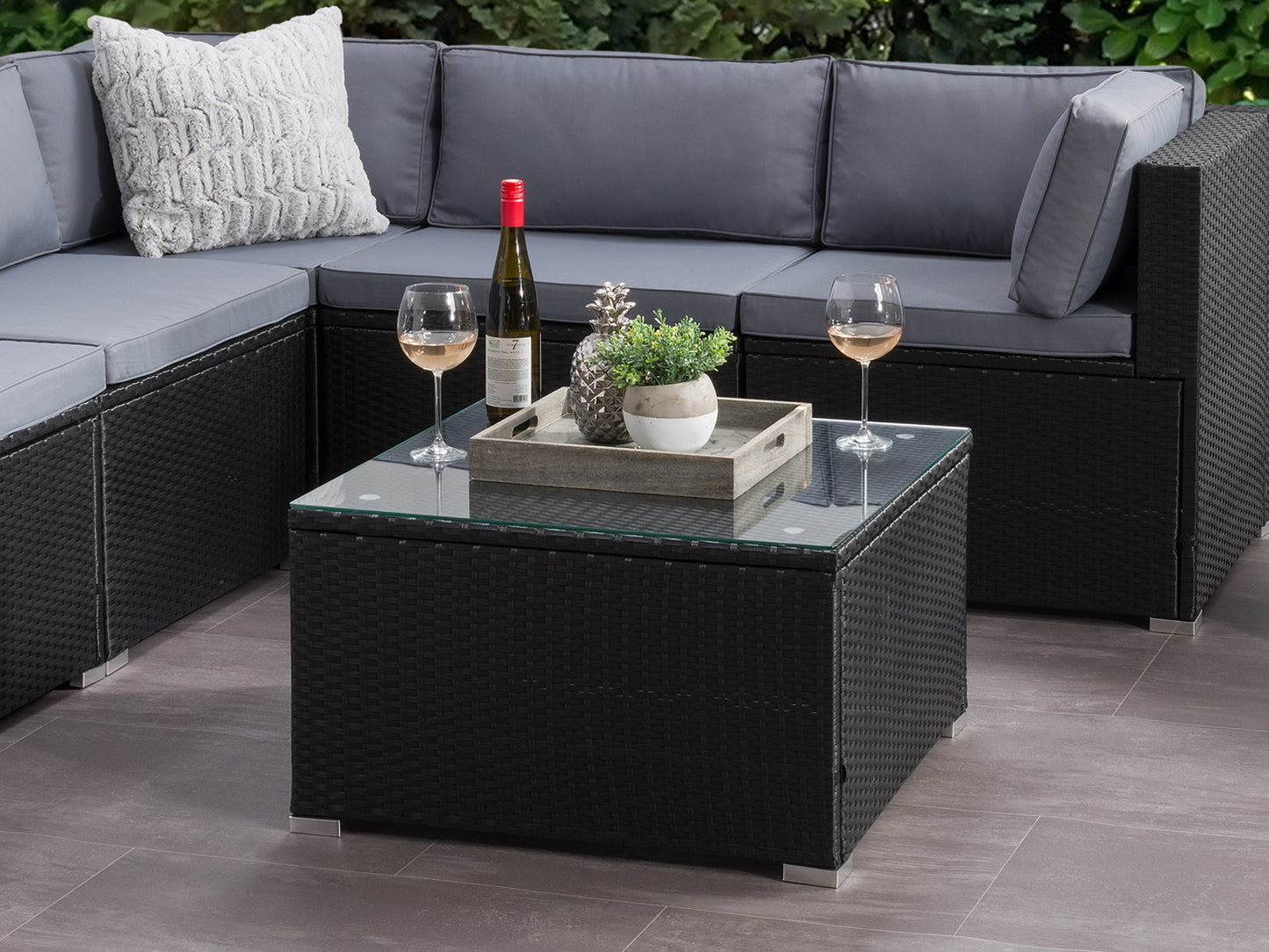 Black square outdoor coffee table with sleek design, durable materials, and minimalist style for patio or garden settings.