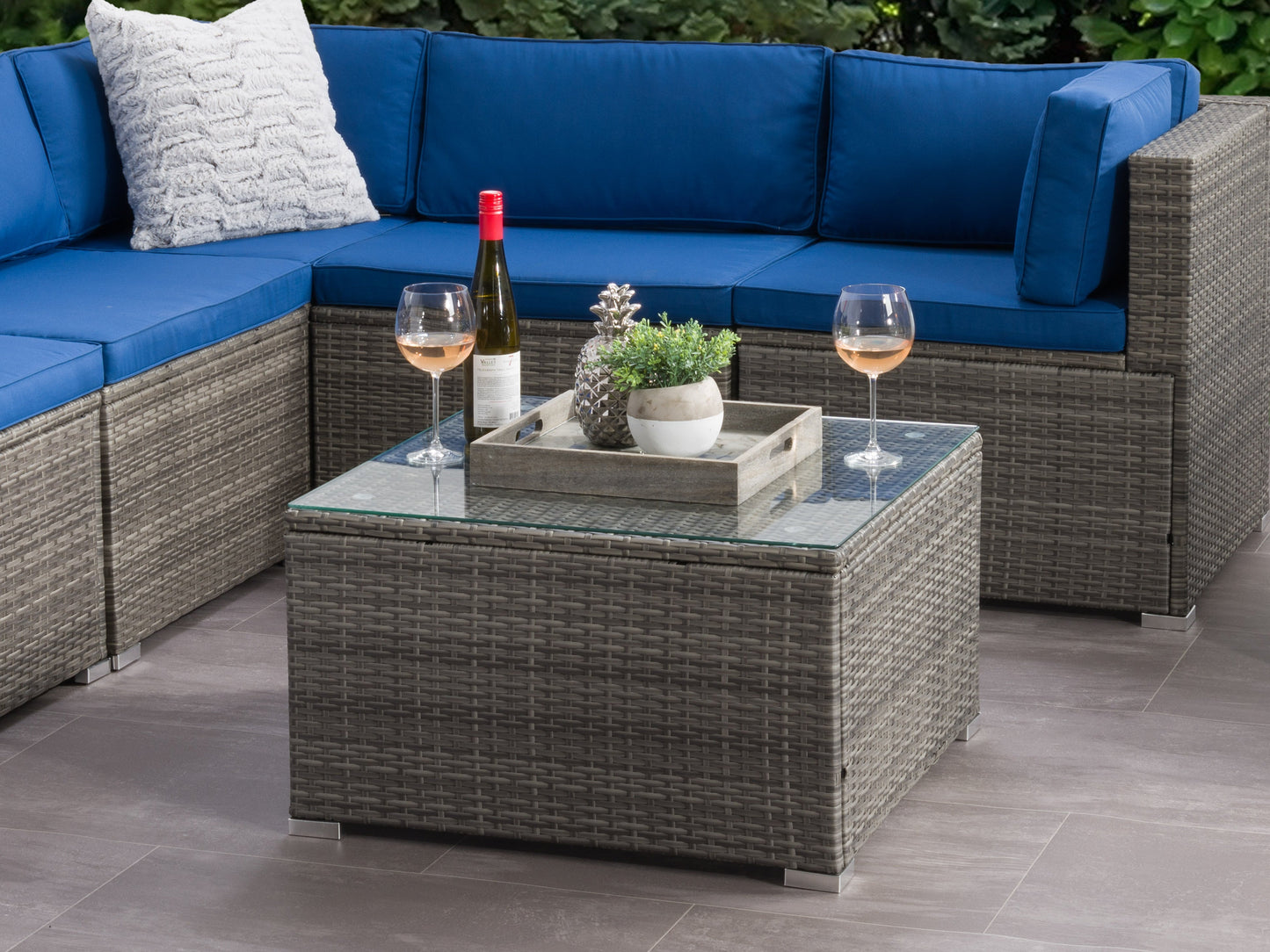 Square grey outdoor coffee table with slatted top and sturdy metal frame, perfect for patio and garden spaces.