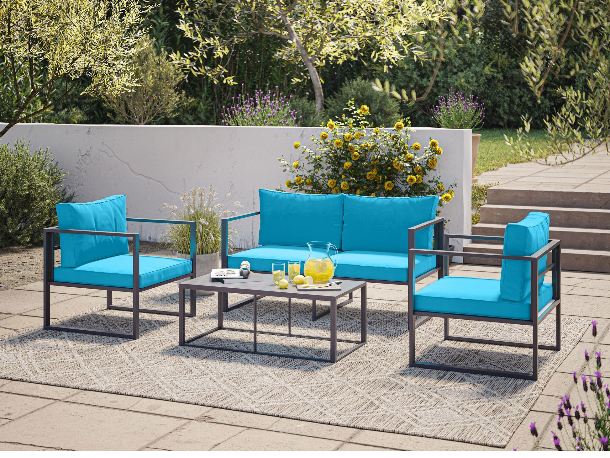 Turquoise 4-piece patio conversation set with cushioned seats, rattan wicker frame, and glass-top coffee table.