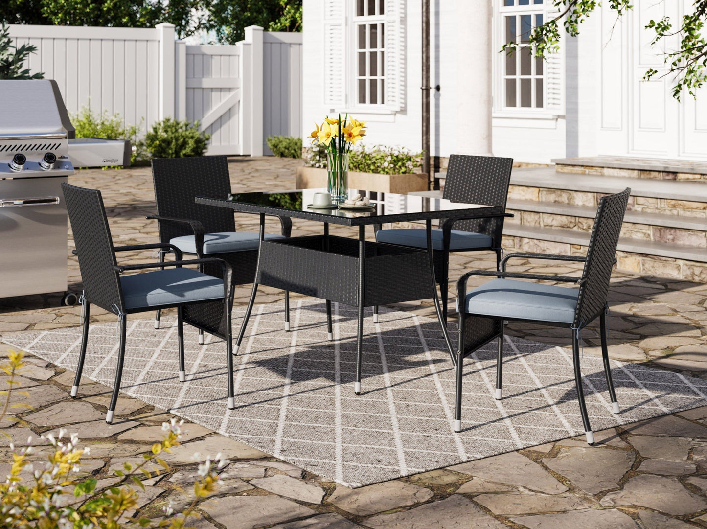 Elegant 5-piece patio dining set with grey cushioned chairs and a sleek black table, perfect for outdoor gatherings.