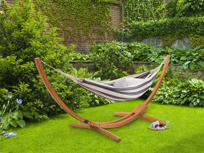 Navy blue and white patio hammock with wooden stand, durable fabric, and stylish outdoor design.