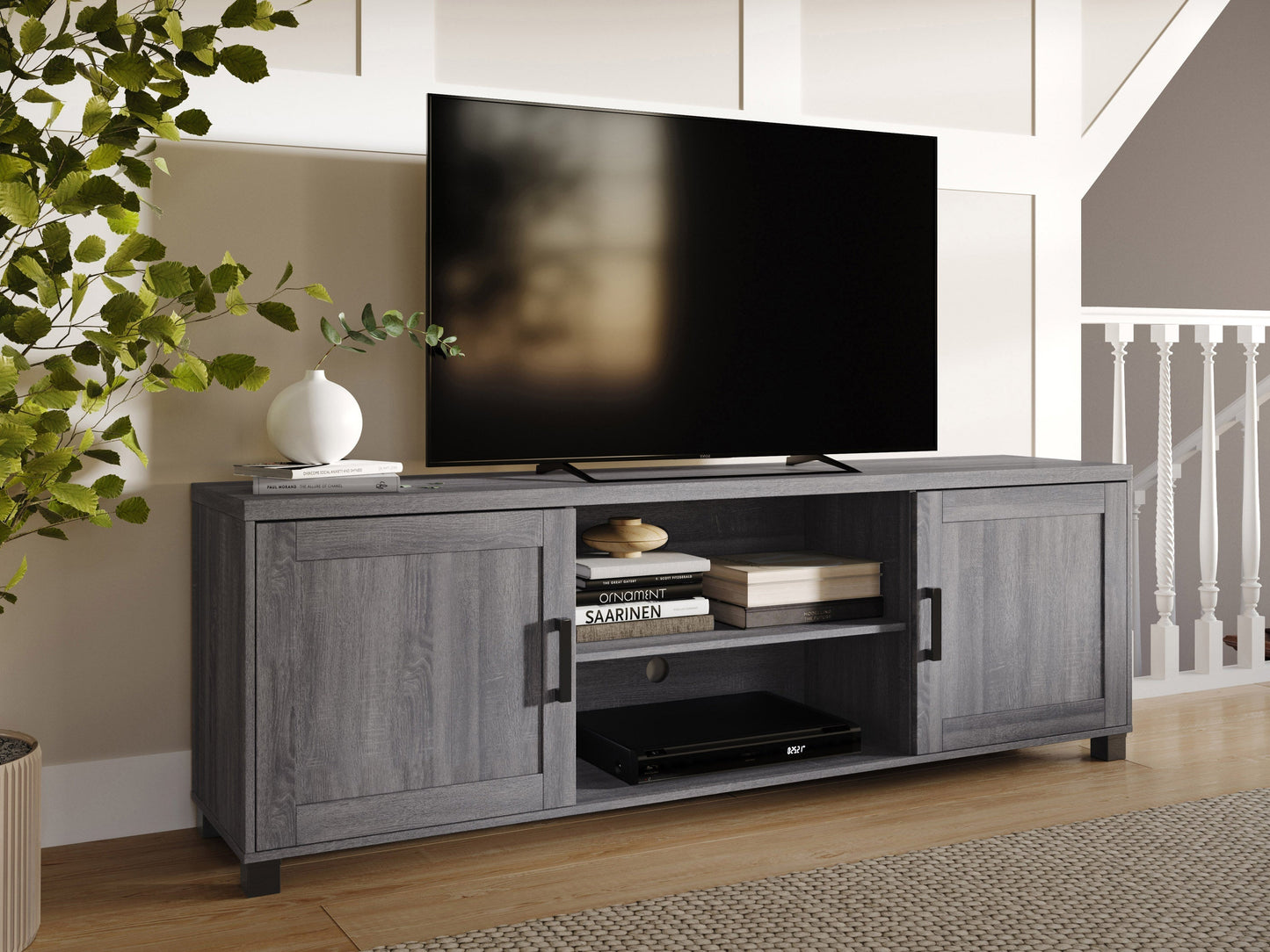 Dark grey TV stand with doors, fits TVs up to 85 inches, sleek modern design, sturdy wood construction.