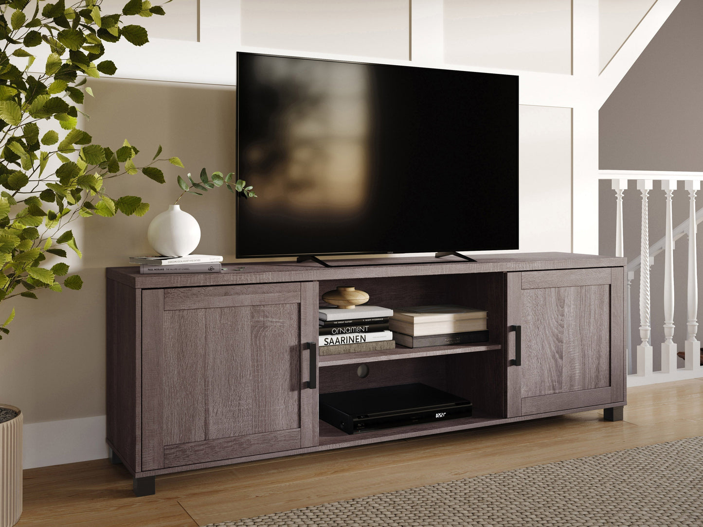 Brown TV stand with doors, fits TVs up to 85 inches, modern design, wooden texture, ample storage space.