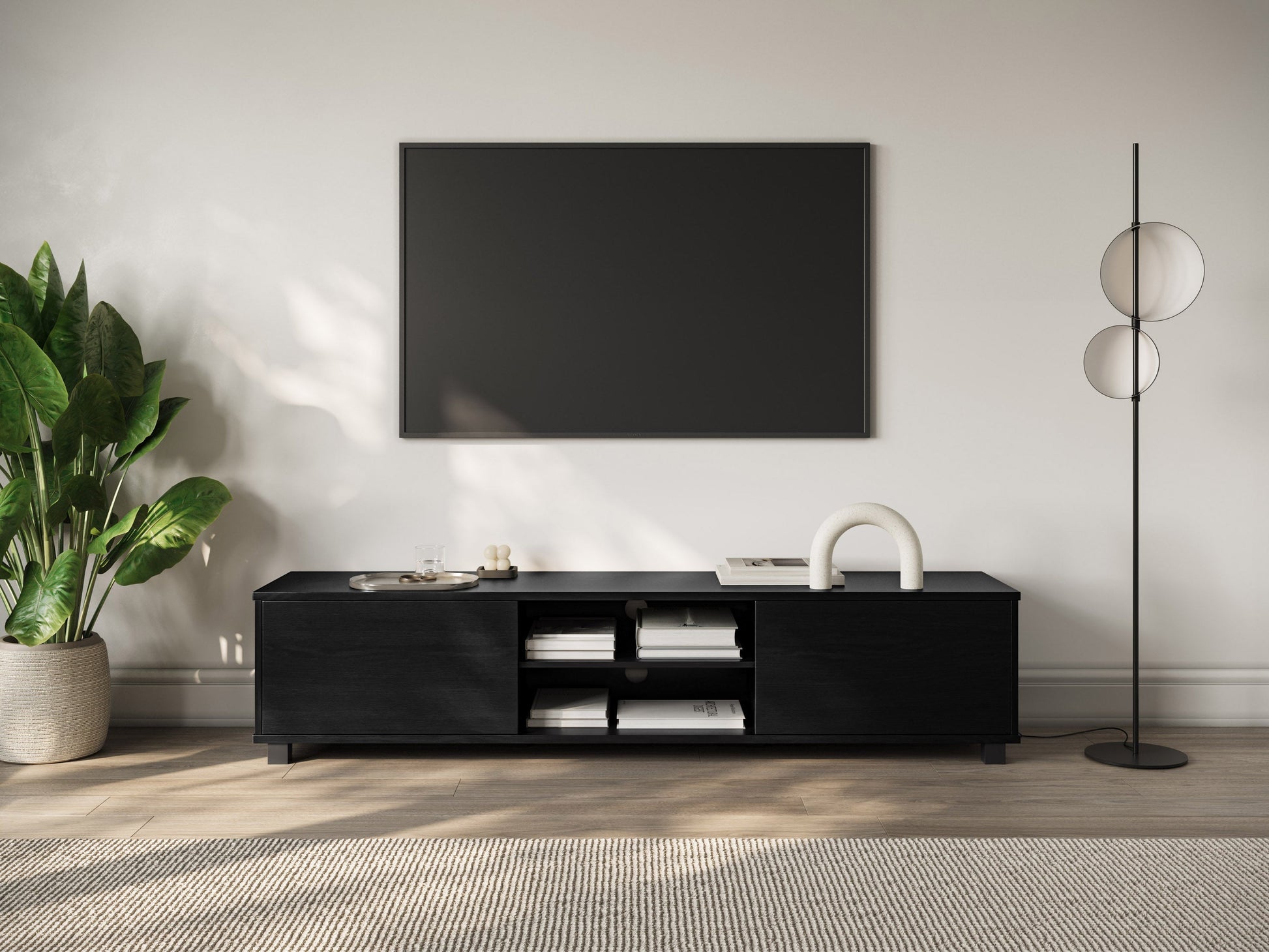 Modern black TV stand for 85" TVs, sleek design with open shelves, and cable management features.