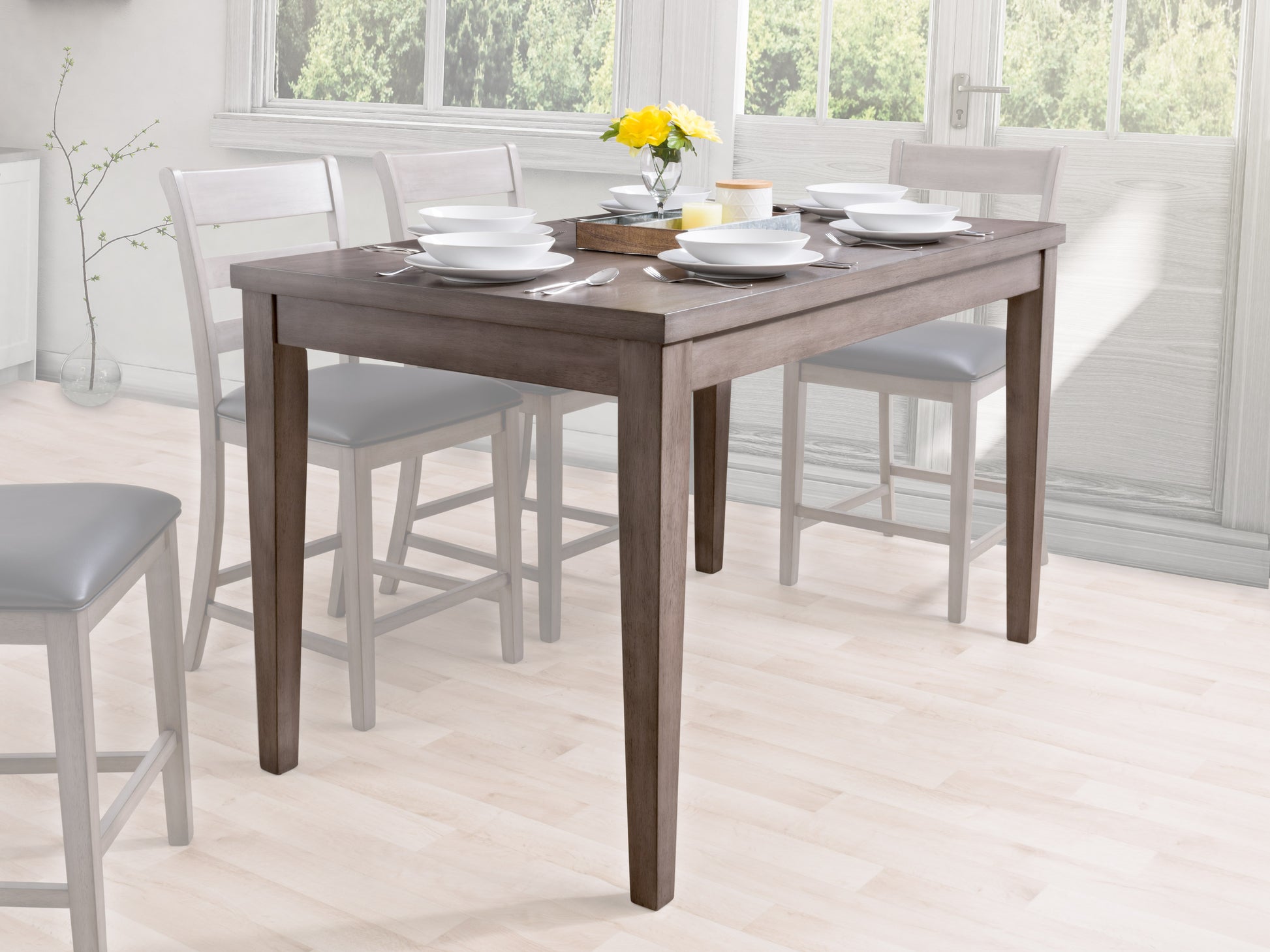 Counter height grey wood dining table with sleek lines, sturdy construction, and a smooth finish, ideal for modern dining rooms.