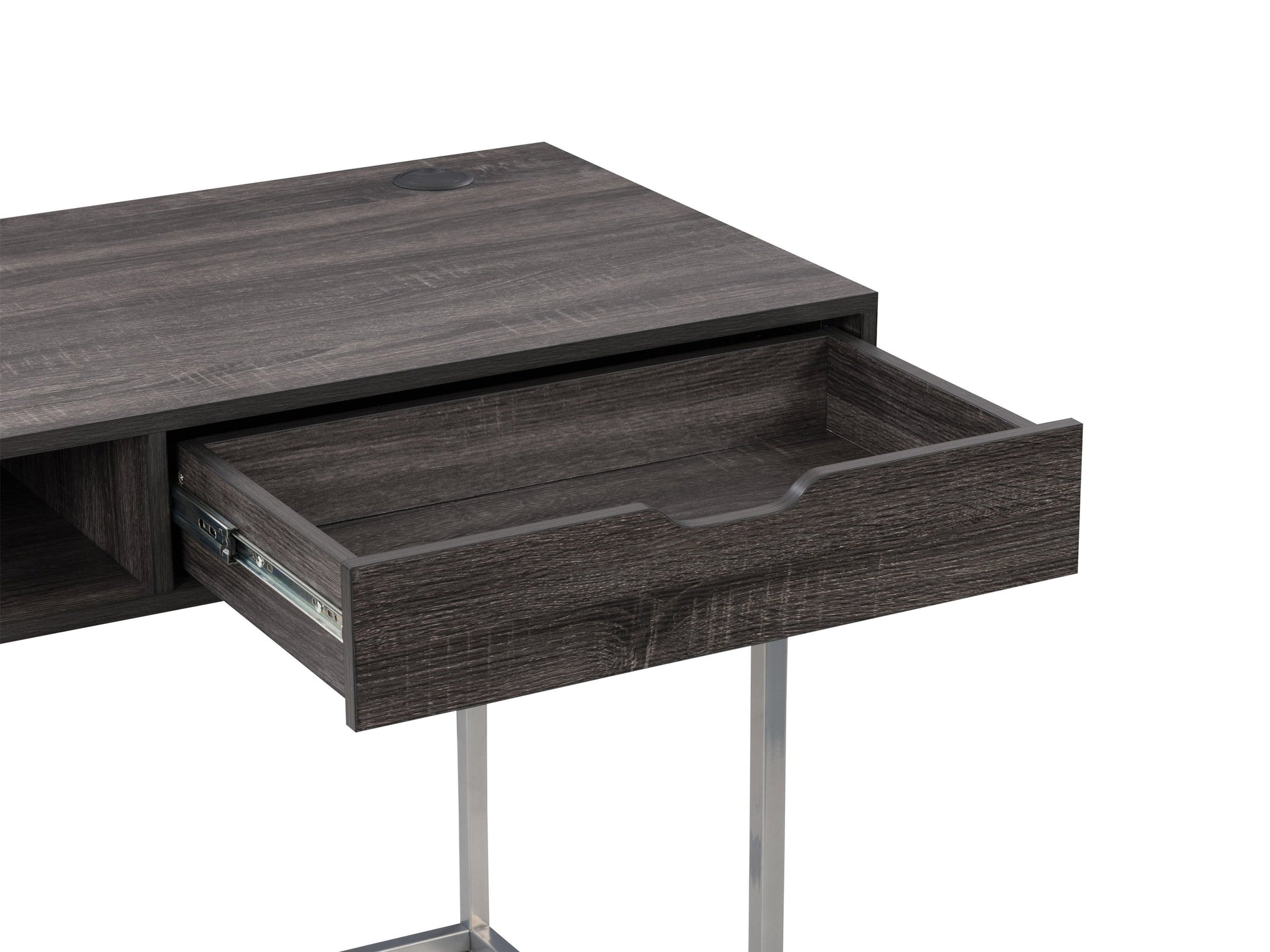 Modern grey computer desk with sleek metal legs, spacious surface, and minimalist design for home office or study.