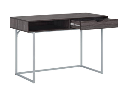 Modern grey computer desk with sleek metal frame, spacious surface, and minimalist design.