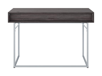 Modern grey computer desk with sleek metal legs, spacious surface, and minimalist design.