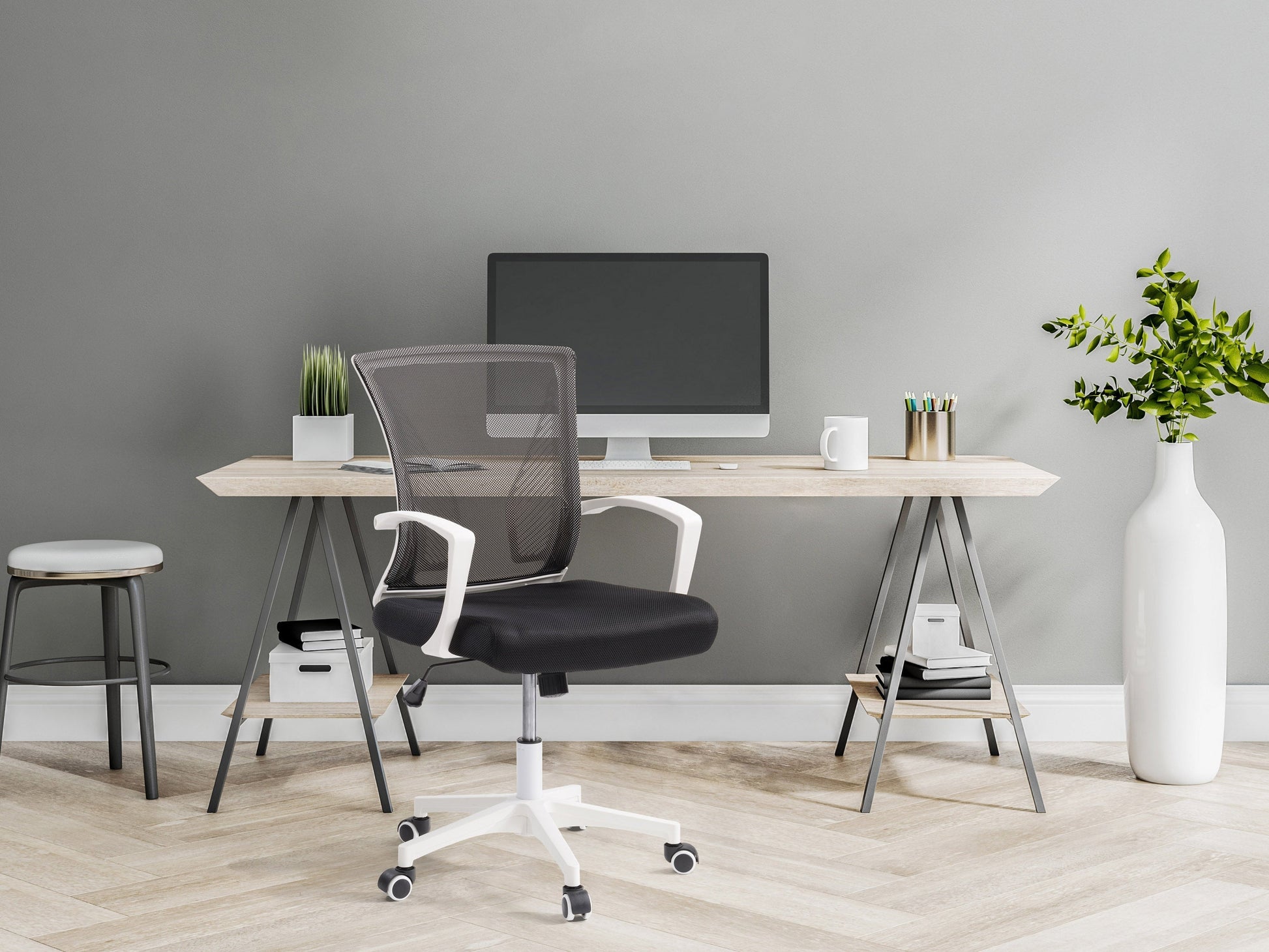 Black and white mesh task chair with ergonomic design, adjustable height, and padded seat for office use.