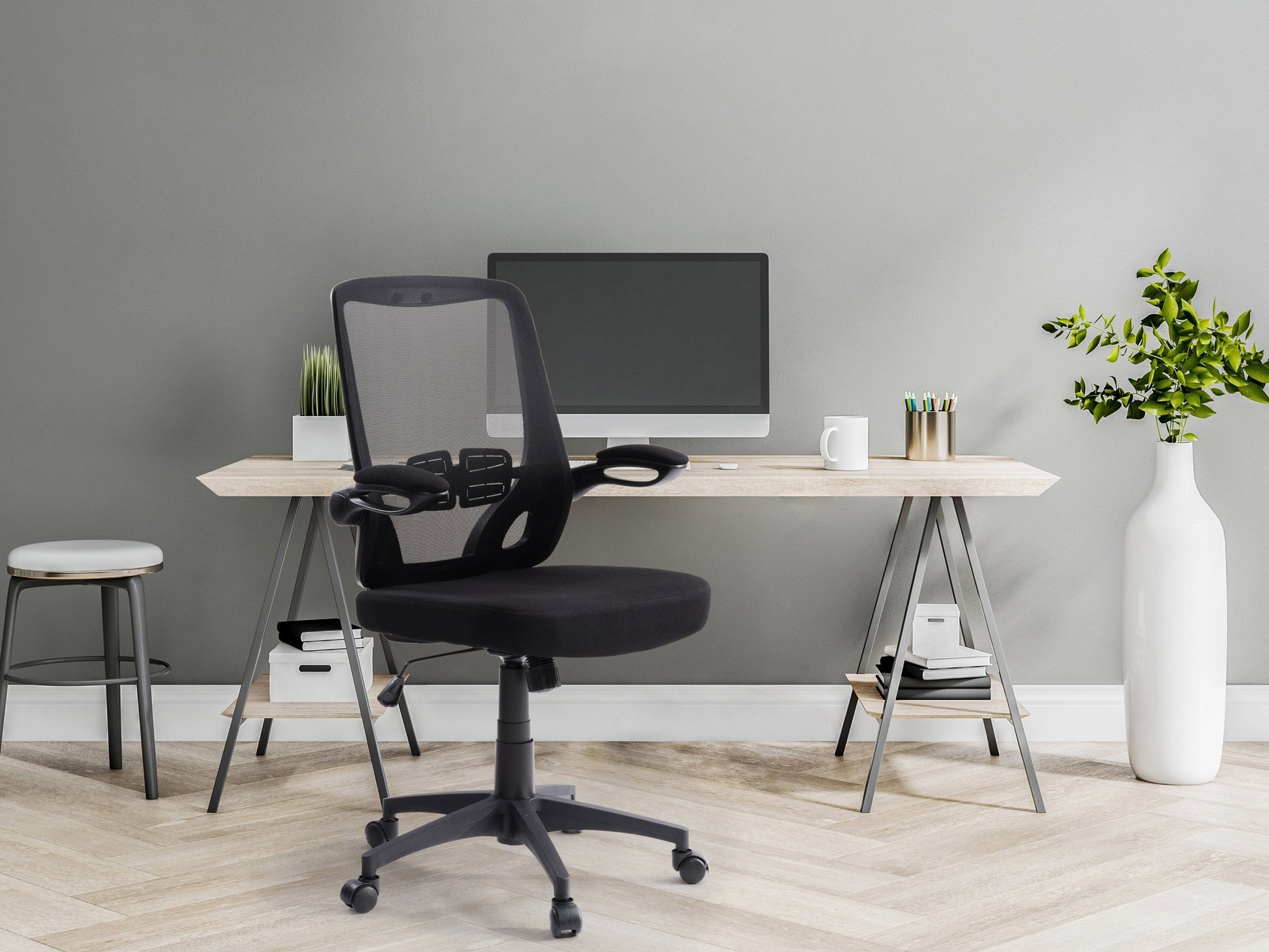 Black mesh office chair with ergonomic design, adjustable height, and lumbar support for comfortable office seating.