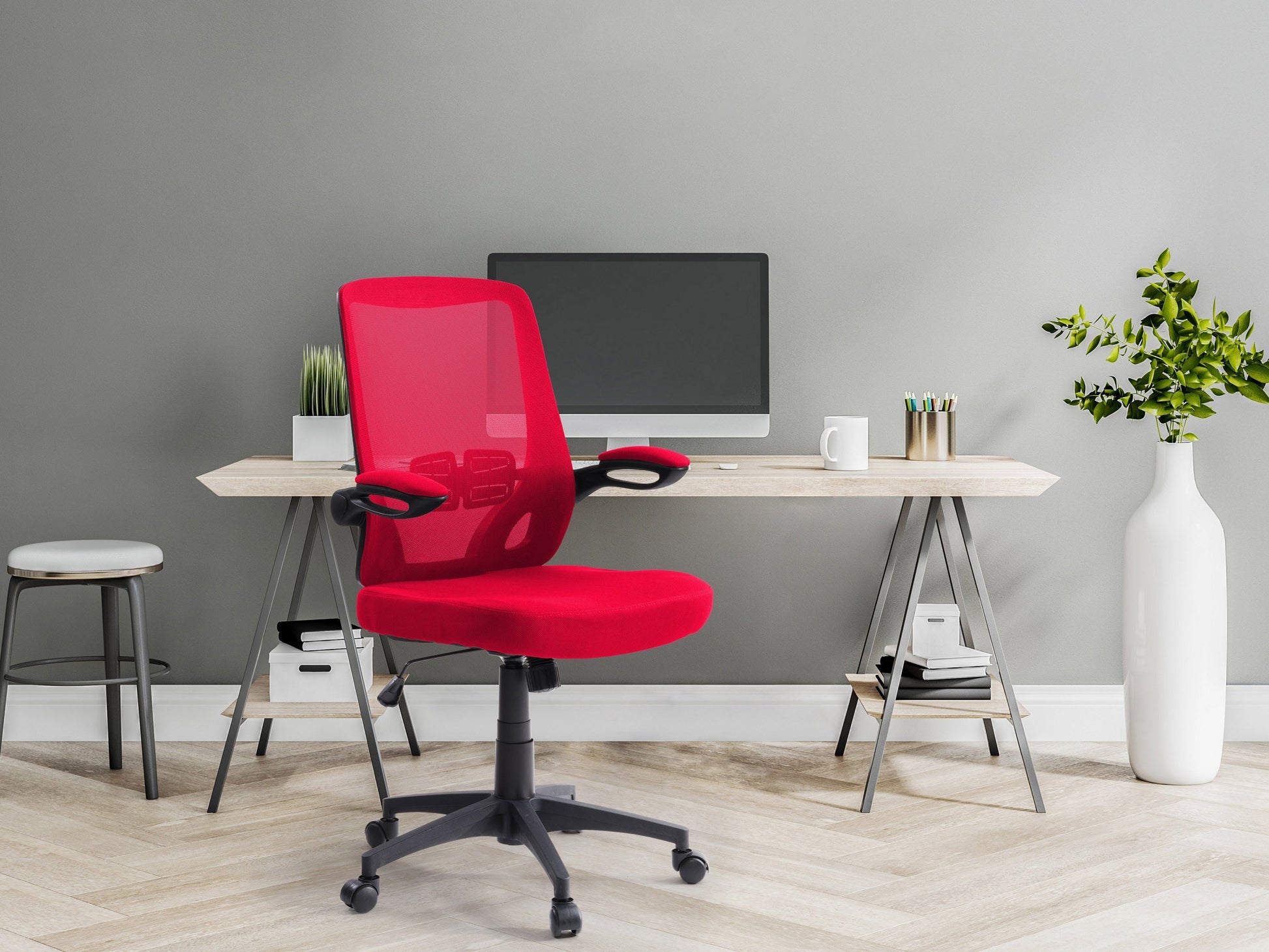 Red mesh office chair with ergonomic design, adjustable height, and black swivel base.