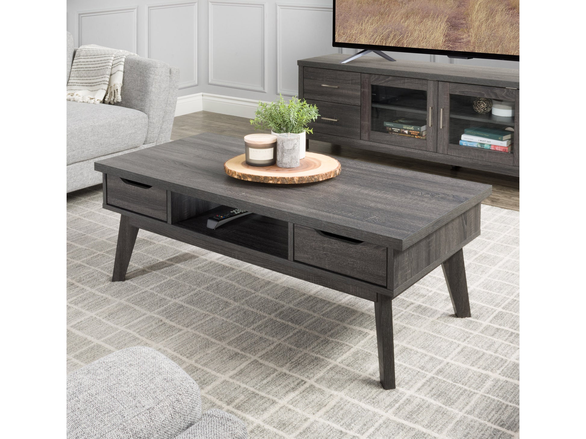 Mid-century modern coffee table with a walnut finish, sleek rectangular design, tapered wooden legs, and a lower shelf for storage. Ideal for living rooms seeking stylish, functional furniture.