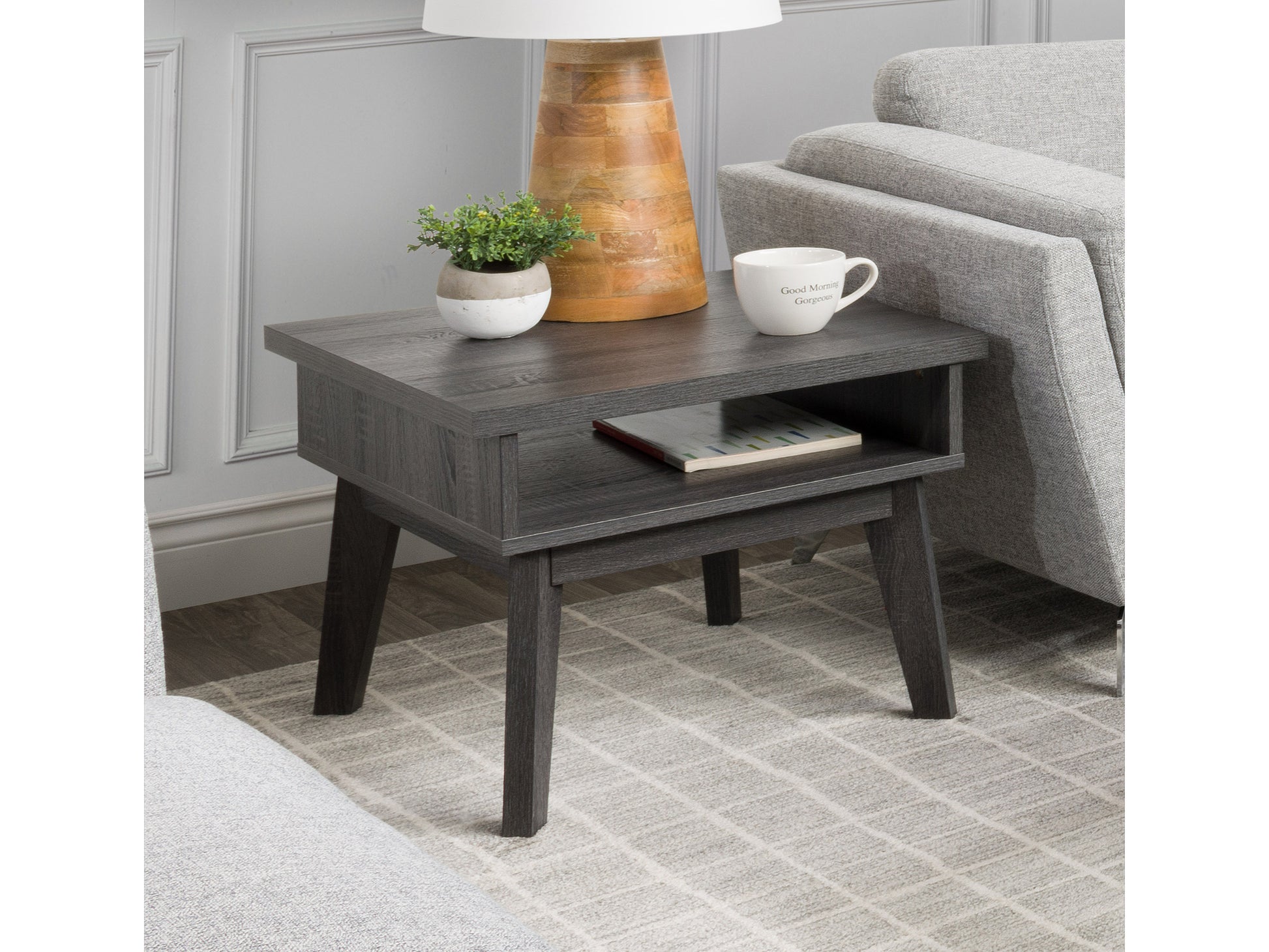 Mid-century modern side table with walnut finish, featuring a single drawer with brass handle, tapered legs, and smooth surface, perfect for living room or bedroom decor.