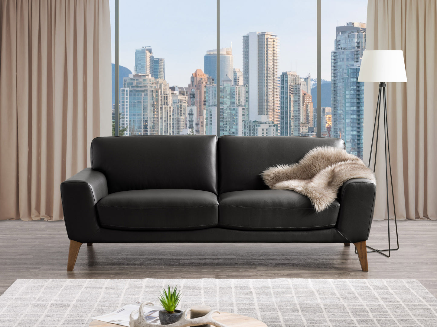 Brown faux leather sofa with tufted backrest, wooden legs, and modern design; perfect for living rooms.