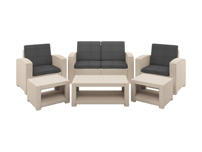 Modern patio conversation set with gray wicker frame, plush white cushions, and tempered glass coffee table, set on a wooden deck. Ideal for outdoor lounging and entertaining.