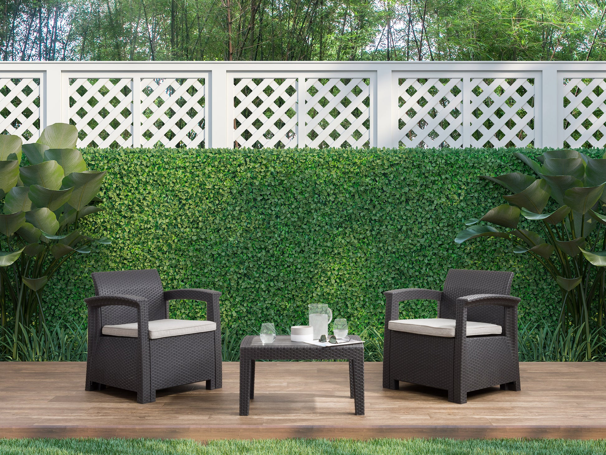 3-piece patio conversation set with gray cushions and black metal frames, featuring a glass-top coffee table, two cushioned armchairs with sleek lines, and weather-resistant materials.