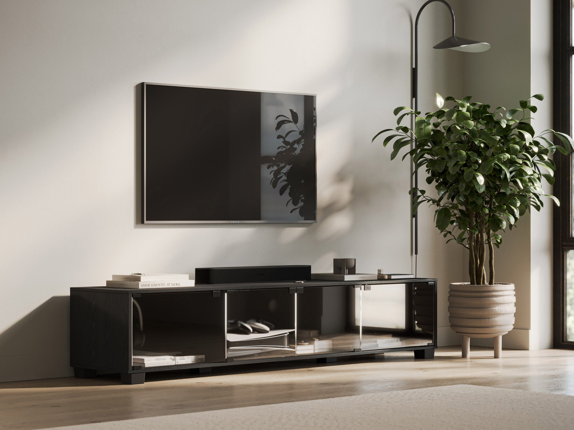 Modern wooden TV stand with two open shelves, two sliding doors, and a sleek black metal frame, ideal for living room storage and media organization.