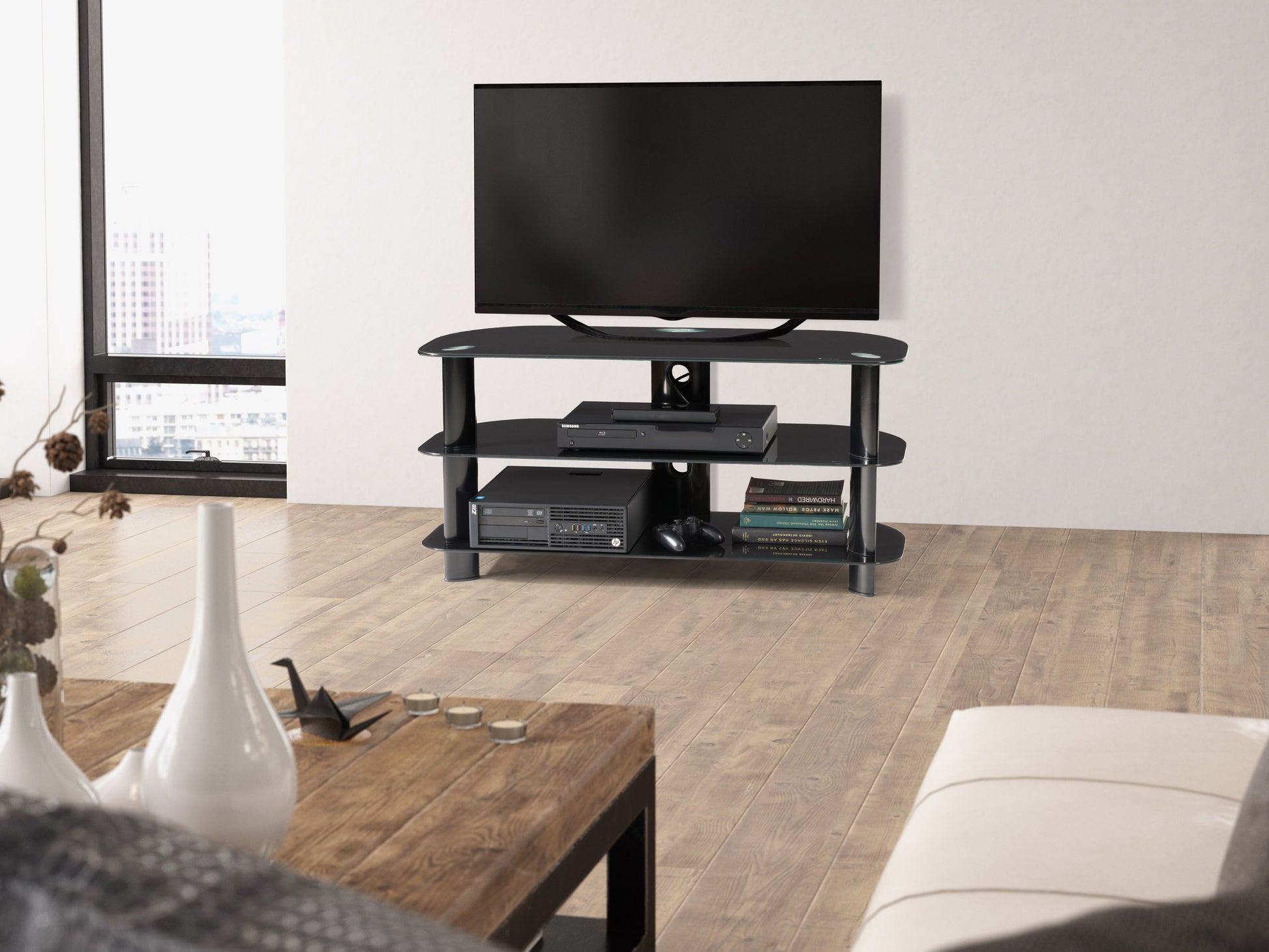 Black glass TV stand with sleek metal frame, three tempered glass shelves, and cable management system, suitable for TVs up to 48 inches. Ideal for modern living rooms and entertainment centers.